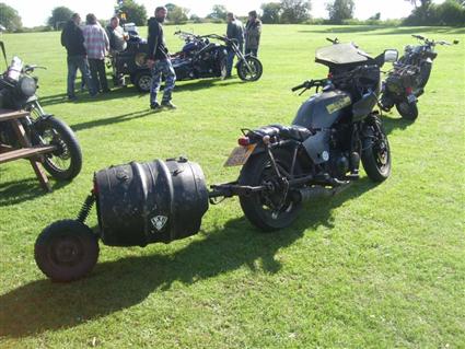 Motorcycle pulling beer barrel trailer