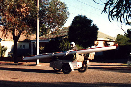 motor cycle side car combination carrying a boat