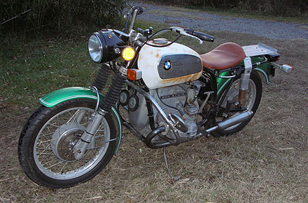 frontal/side view of green and white BMW motorcycle