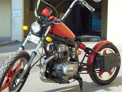 red honda twin hardtail motorcycle