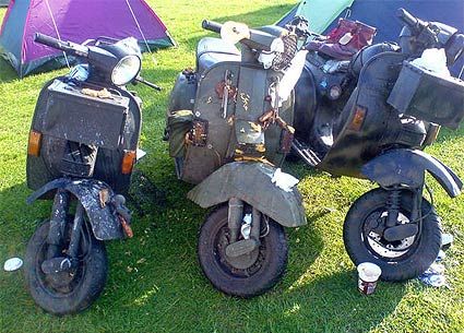 3 camoflaged scooters