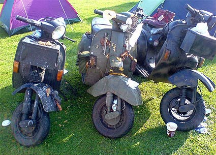 3 camoflaged scooters